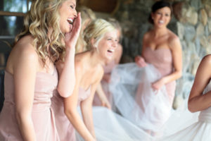 candid bridesmaids laughing