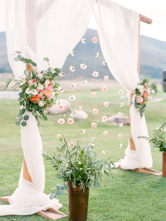 floral archway outdoor wedding