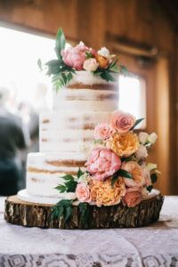 naked wedding cake in barn
